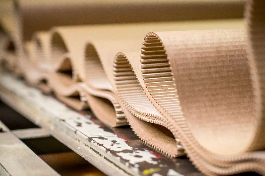 Cardboard packing materials being manufactured