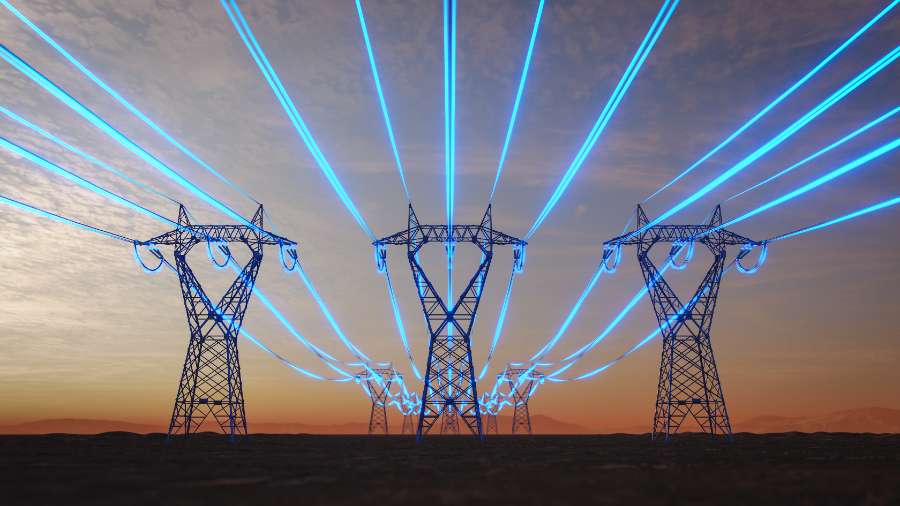 Power lines glowing blue and running along towers